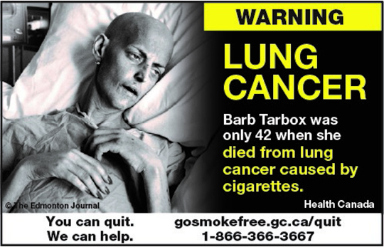 A warning label showing an image of a frail woman dying of lung cancer